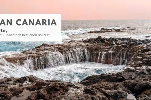 Felsige Küste mit tosenden Wellen, die in eine natürliche Felsformation stürzen. Gran Canaria Highlights: 10 Orte, die du besuchen solltest.
