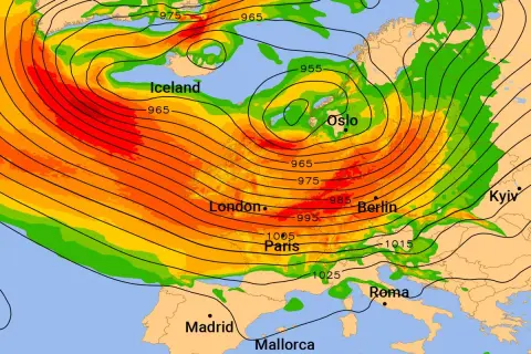 Wetterkarte zeigt Tiefdruckgebiet über Island mit roten und orangen Farbtönen. Isolinien zeigen niedrigen Luftdruck.