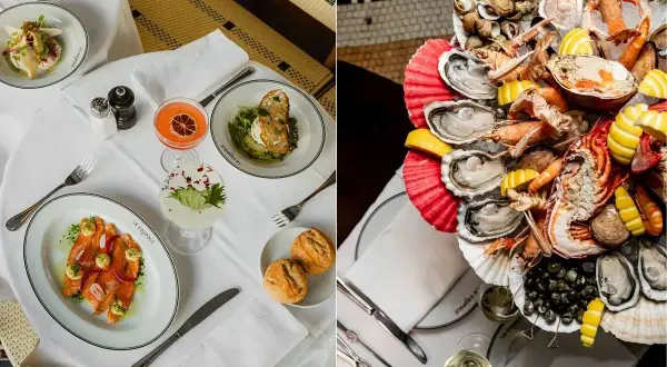 Festliches Meeresfrüchte-Platter mit Hummer, Austern und Garnelen, serviert auf Eis. Daneben ein Tisch im La Coupole Paris mit Lachs und Cocktails.